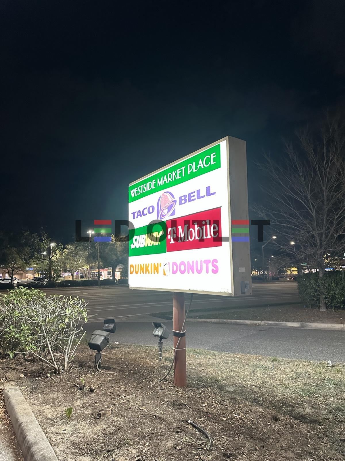 Plaza pylon sign lit at night after LED retrofit, Orlando FL