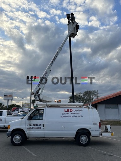 LED OUTLET bucket truck at a commercial job