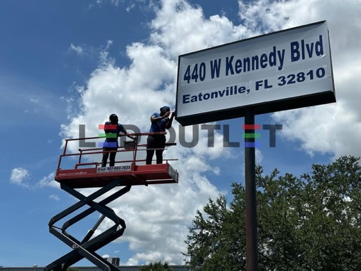 Crew on a lift servicing the 440 W Kennedy Blvd pylon sign, Eatonville FL