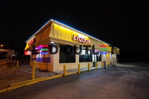 Liquor store roofline edge lit with LED at night