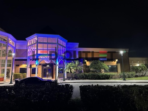 Building edge lit purple with RGB LED at night