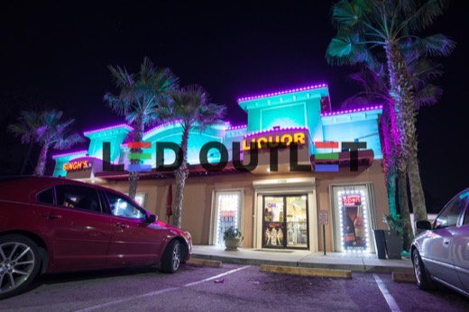 Restaurant building edge lit teal and pink with RGB LED