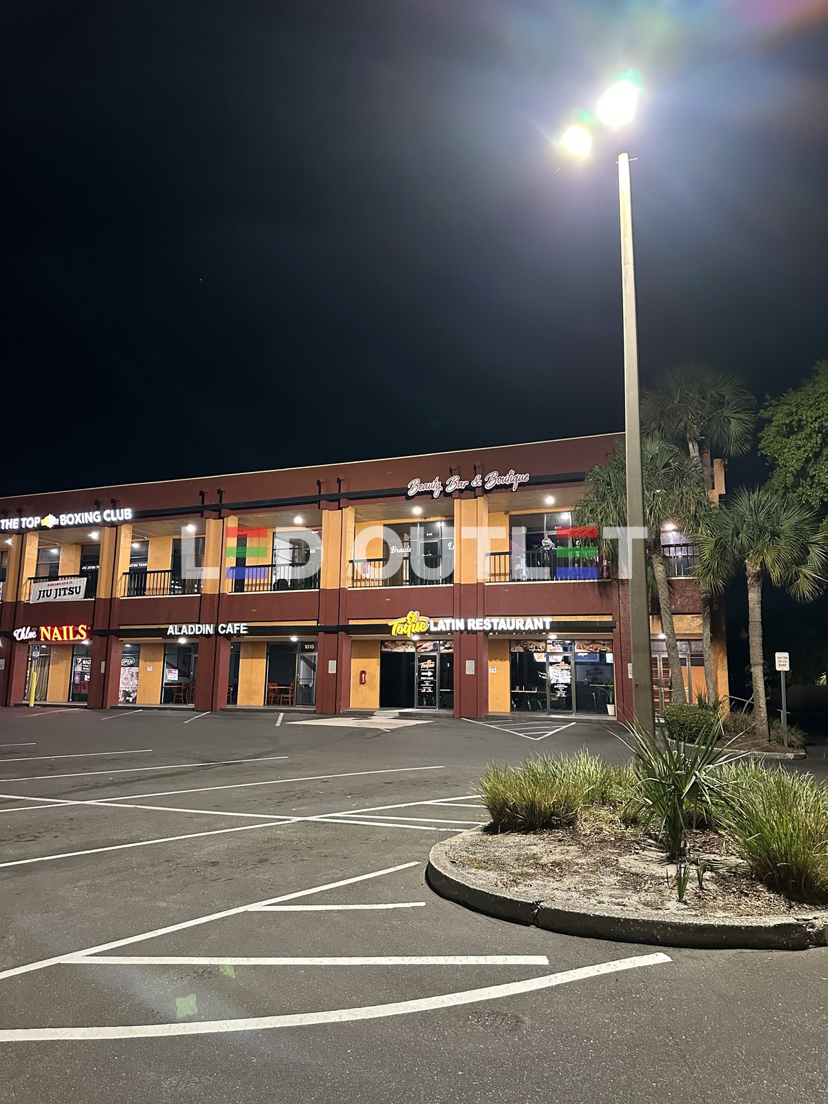 Commercial plaza nighttime parking lot LED lighting Orlando