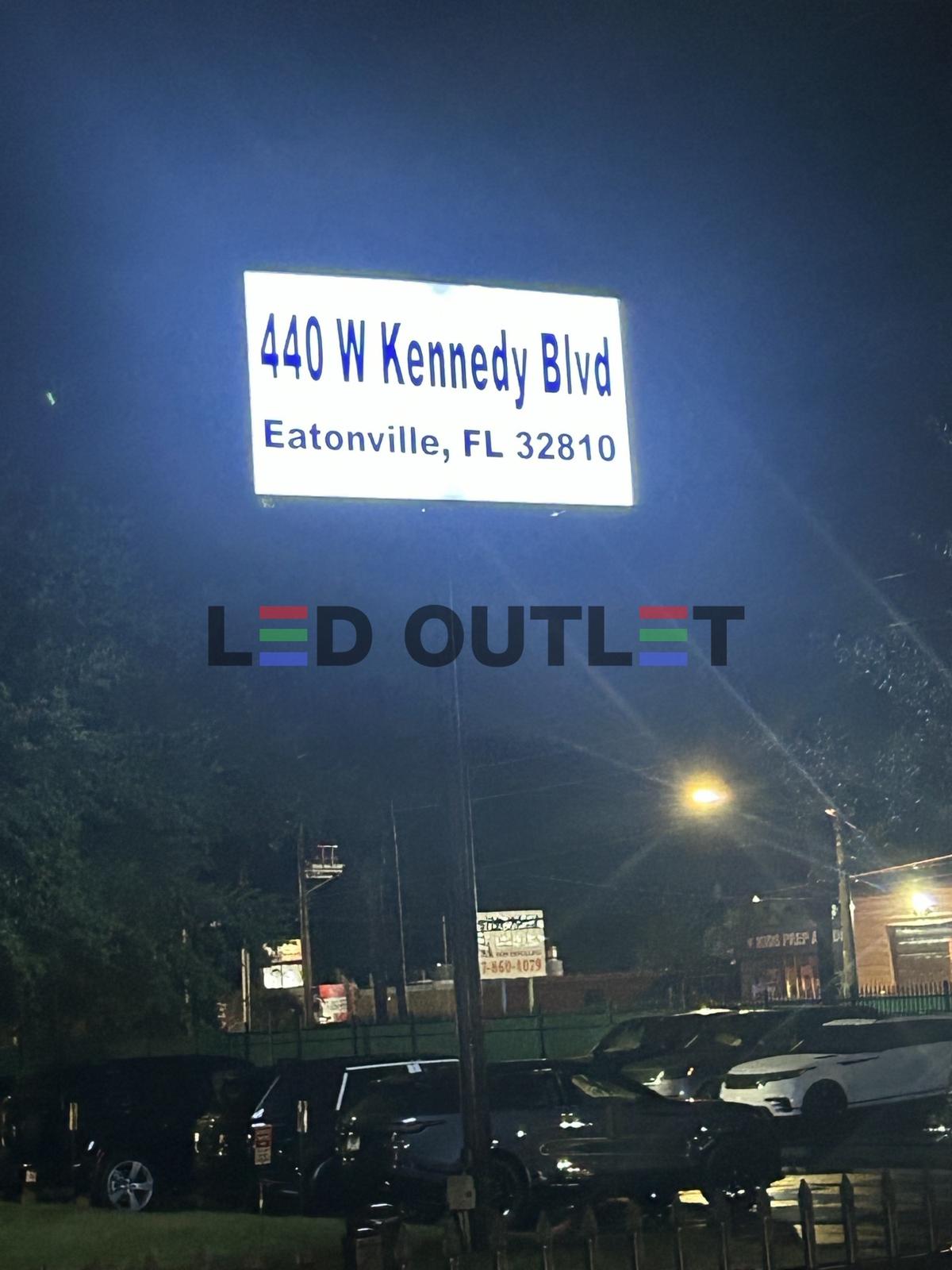 LED wall pack installation on commercial building