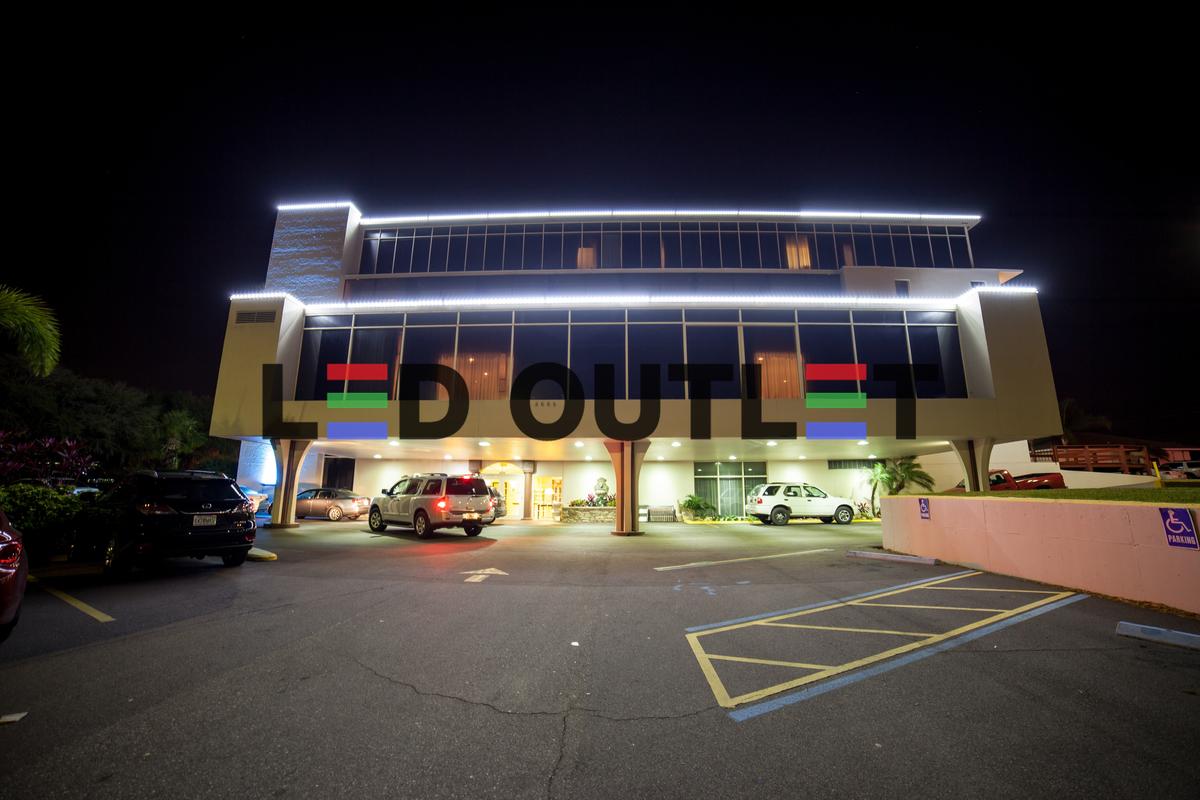 Modern commercial building with LED accent lighting along roofline