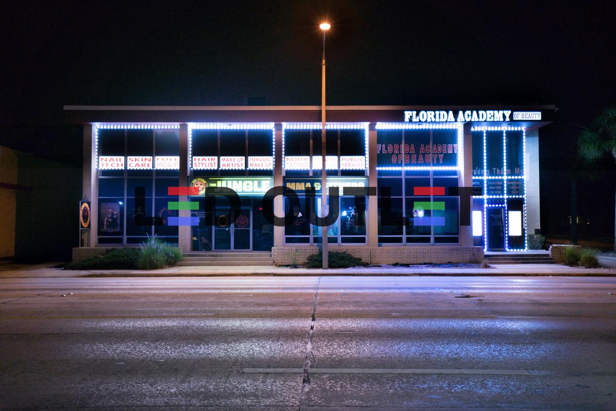 Florida Academy building with blue and white LED storefront lighting